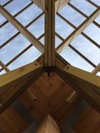 view of the sky through the wooden roof