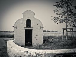 monochrome photo of Religious chapel in a church