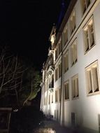 night illumination of the white facade of the building