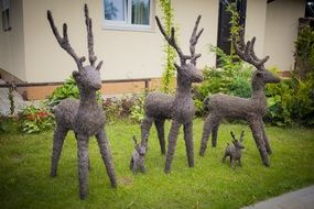 Handmade deers are on the private house garden