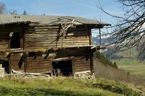 dilapidated wooden house on a hill