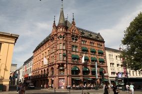 old red brick building on karl johan street in Oslo