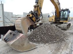 construction equipment near a pile of sand