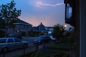 storm and lightning over houses