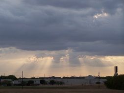 the sun's rays break through the clouds