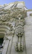 old building exterior with gargoyle