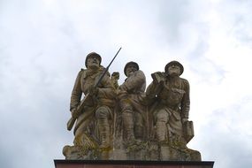 monument of a soldiers on a background of blue sky