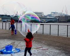 children play with bubbles