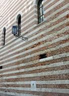 striped facade of the building in Verona