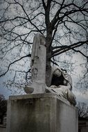 monument on a graveyard on a gray day