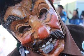 a masked man at festival