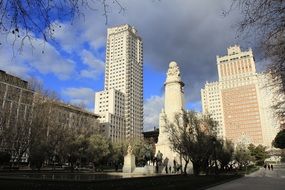 statue of don quixote among the skyscrapers in madrid