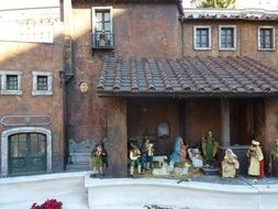 people near the brown house in rome