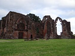 church ruins on green grass in scotland