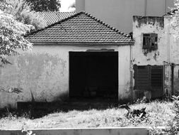 black and white image of an abandoned house