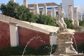 sculpture fountain boy on a fish