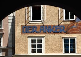 a sign with the words on the house under the windows