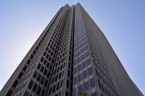 low angle view of grey skyscraper