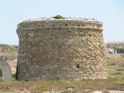 old stone building on the field