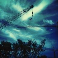 crane construction in dark sky