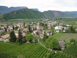 panorama of a village and green fields in South Tyrol, Italy