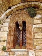 windows in the brick wall of a classical architecture