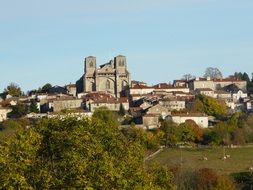 church in village on hill side, france