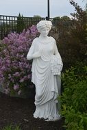 white female statue in the garden