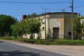 old yellow building at road