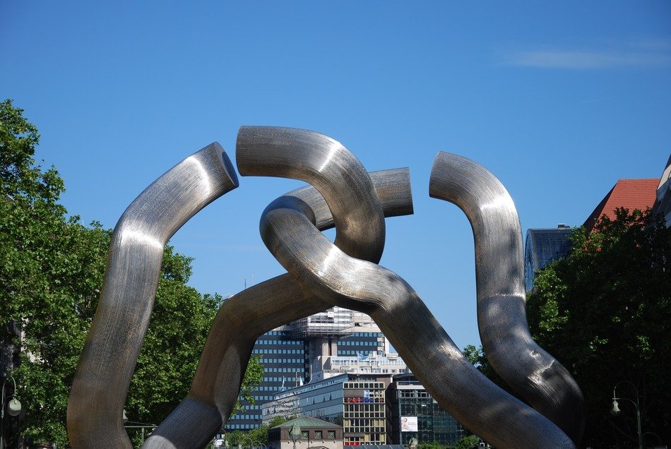berlin installation steel monument among the trees and other buildings