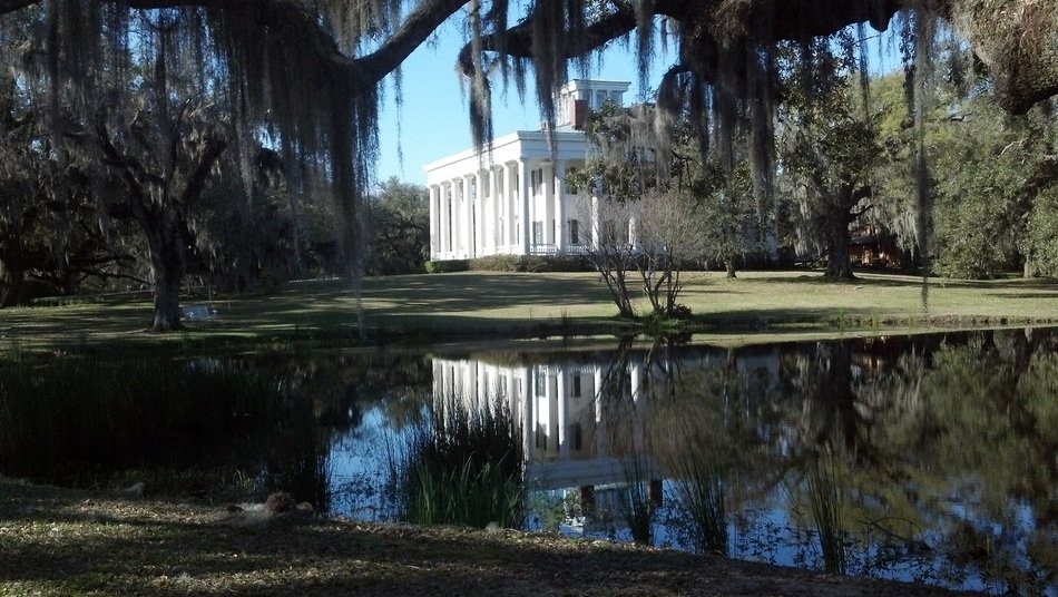 building with columns near the pond