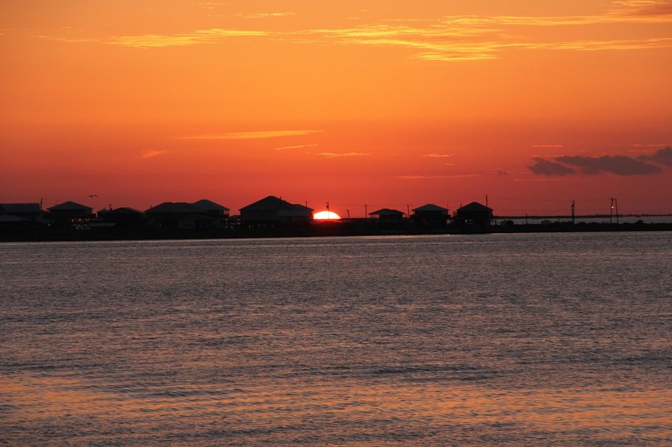 landscape of beautiful sunset in grand isle louisiana