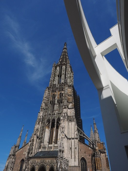 The building of the Ulm cathedral against the background of the clear sky