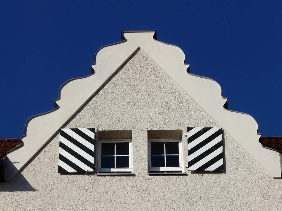 striped shutters on the facade of the building
