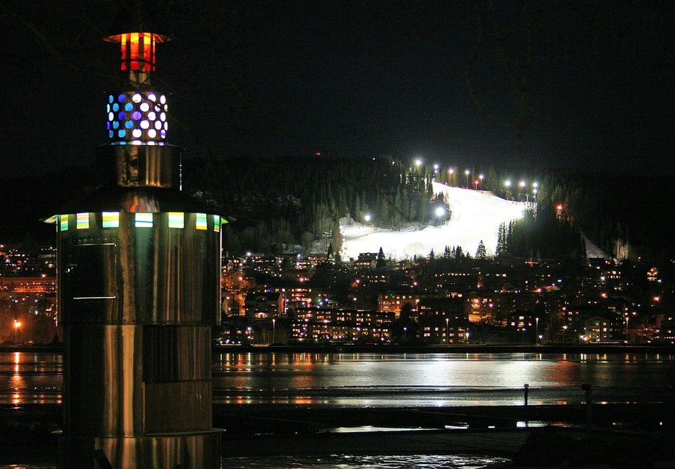mountain slope and city by the water on the island of Frosen