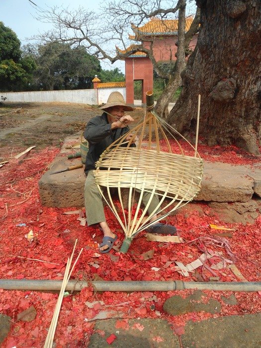 man in china weaves a basket