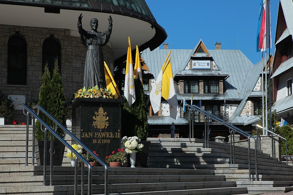 pope john paul ii statue at the entrance to the church