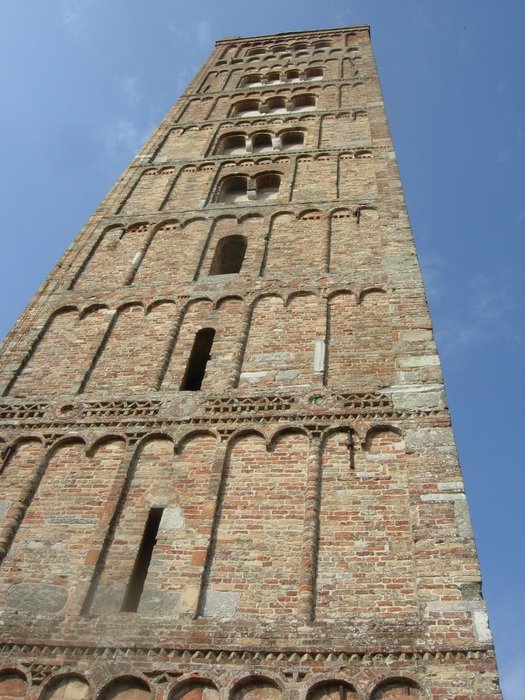 tower stretches into the sky, italy