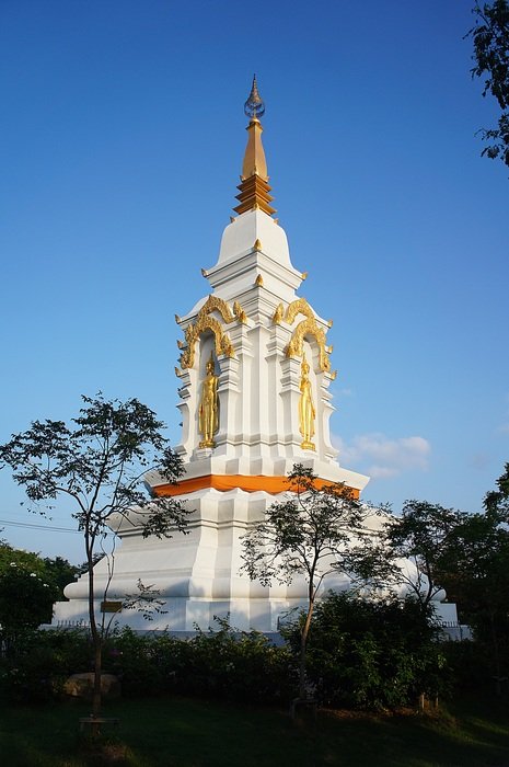 thailand temple with silhouettes on blue sky background