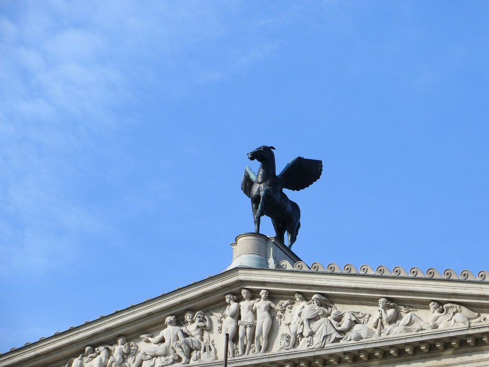 statue on a old opera's roof in frankfurt