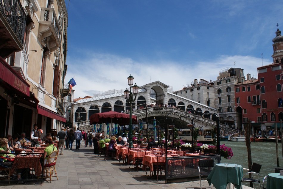 tourists near the rialto bridge in venice