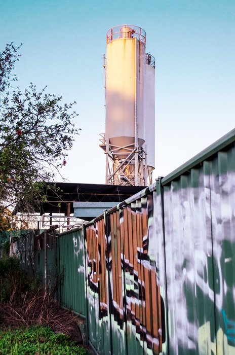 tower behind the wall with graffiti