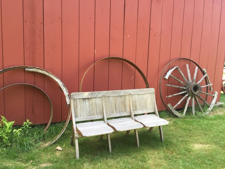 wooden bench against the background of the pink wall on the ranch