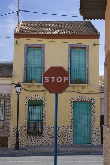 Sign 'Stop' near the house