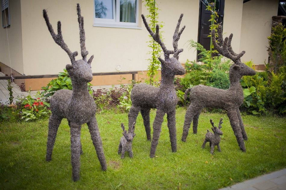 Handmade deers are on the private house garden