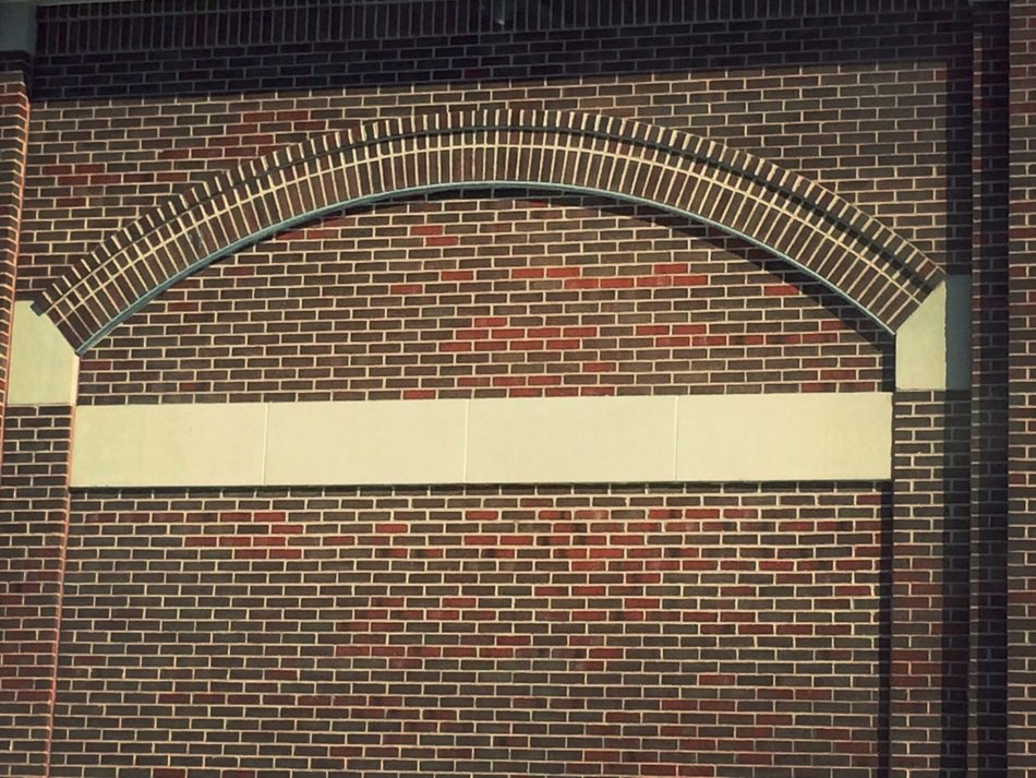 brick wall with white stripe