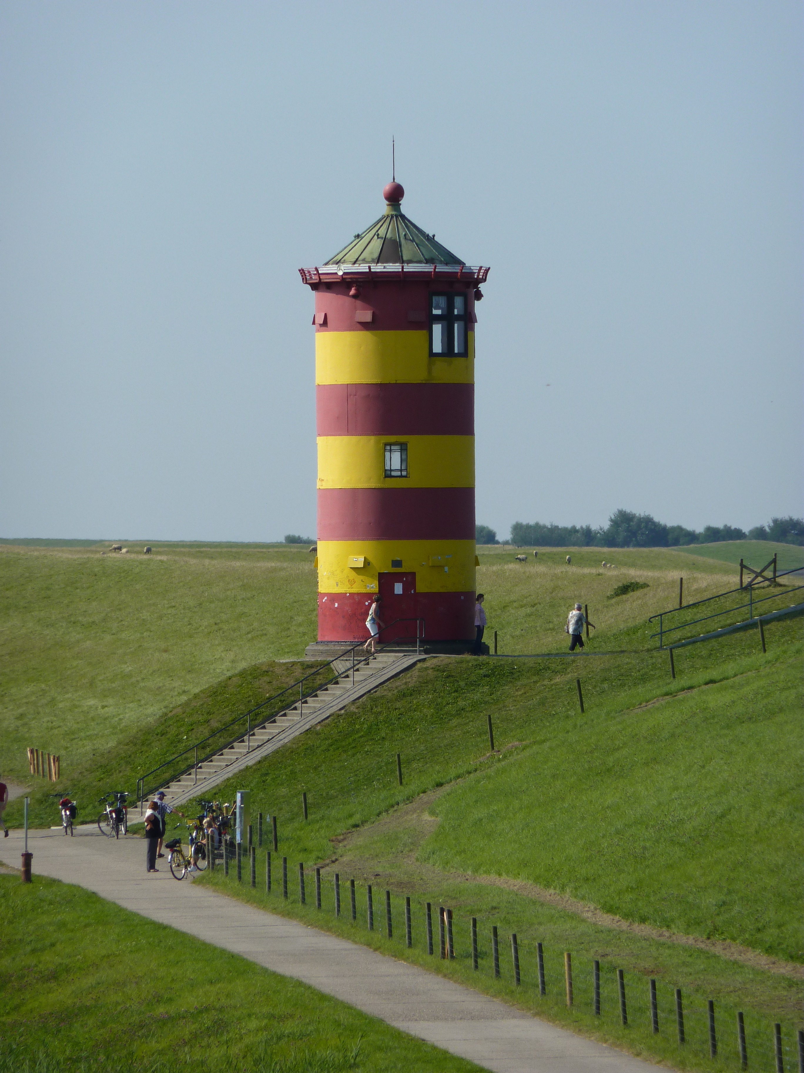 Red and yellow lighthouse in Germany free image download