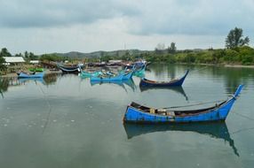 fishing boats on a river in Asia