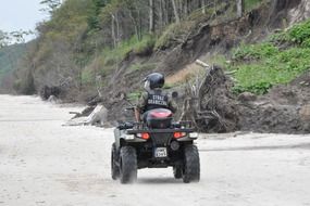 picture of the border guard on sand beach riding