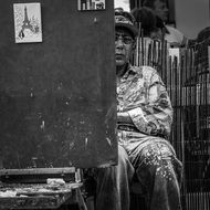 black and white photo of the artist in paris